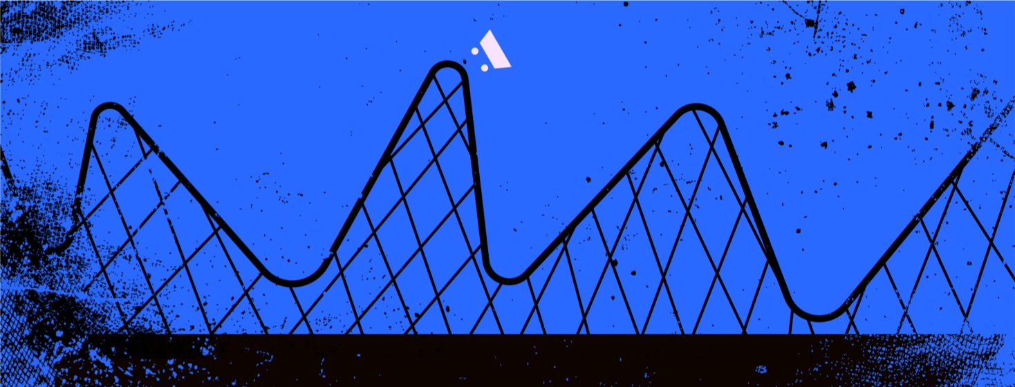 A roller coaster going up and down on a track