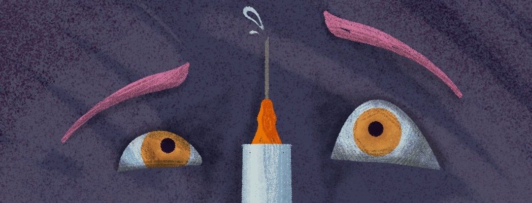 Closeup view of persons concerned looking eyes looking at a syringe of insulin.