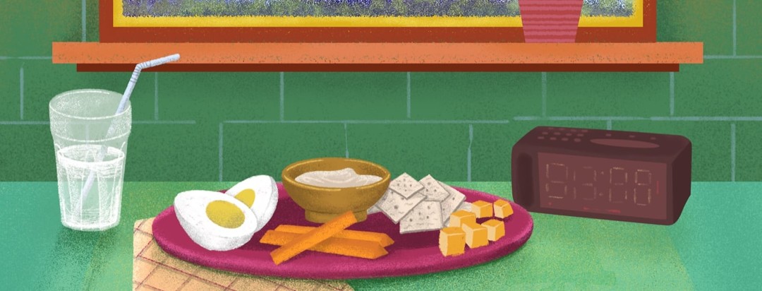 A plate of hardboiled eggs, carrot sticks, hummus, crackers, and cheese. A glass of water sits next to the plate of snacks.