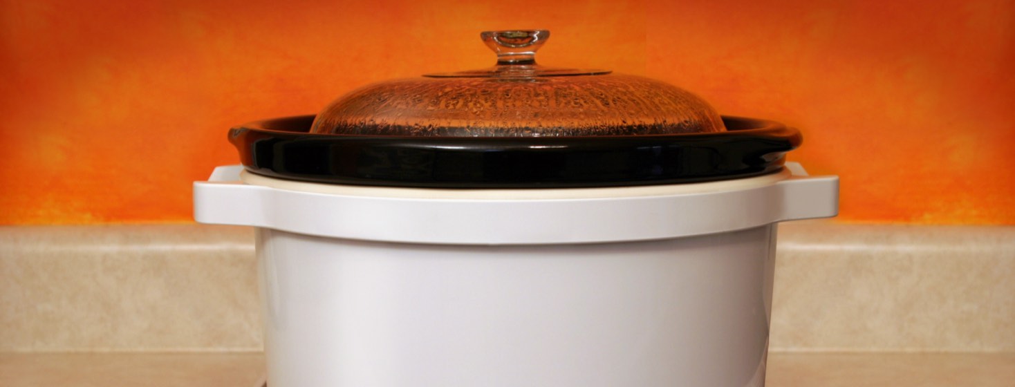 A slow cooker on a kitchen counter.