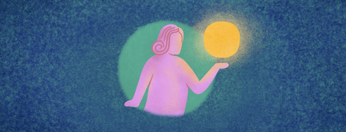 a woman holding a glowing orb