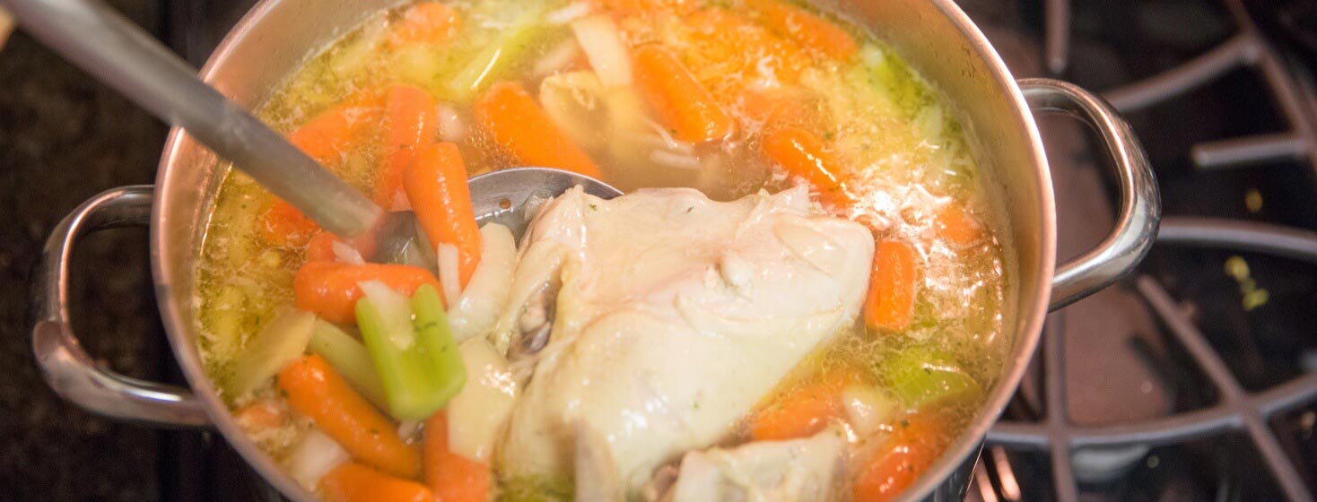 Pot of rotisserie chicken soup on stovetop