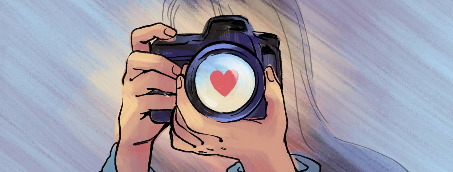 An illustration of a person holding a camera with a heart shape reflected in the lens. Representing living life in the present and to the fullest.